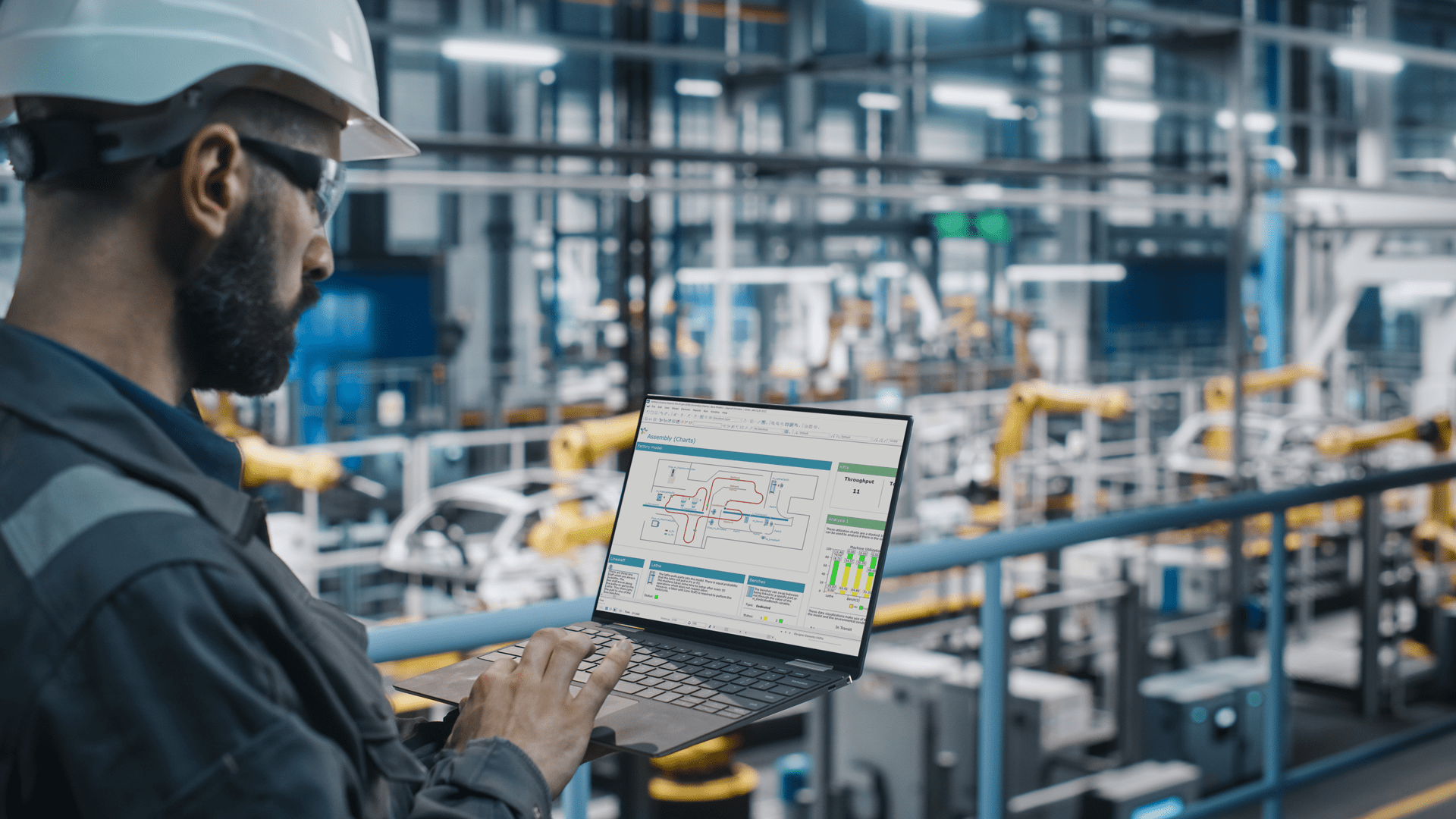 Un ingénieur utilise le logiciel de modélisation par simulation Witness dans l’atelier de production